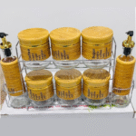 9-piece kitchen spice and oil jar set with a metal stand.