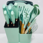 A set of Silicone kitchen utensils with wooden handles and a set of knives in a dual holder.