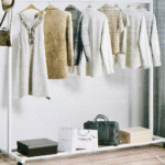 White metal rolling garment rack