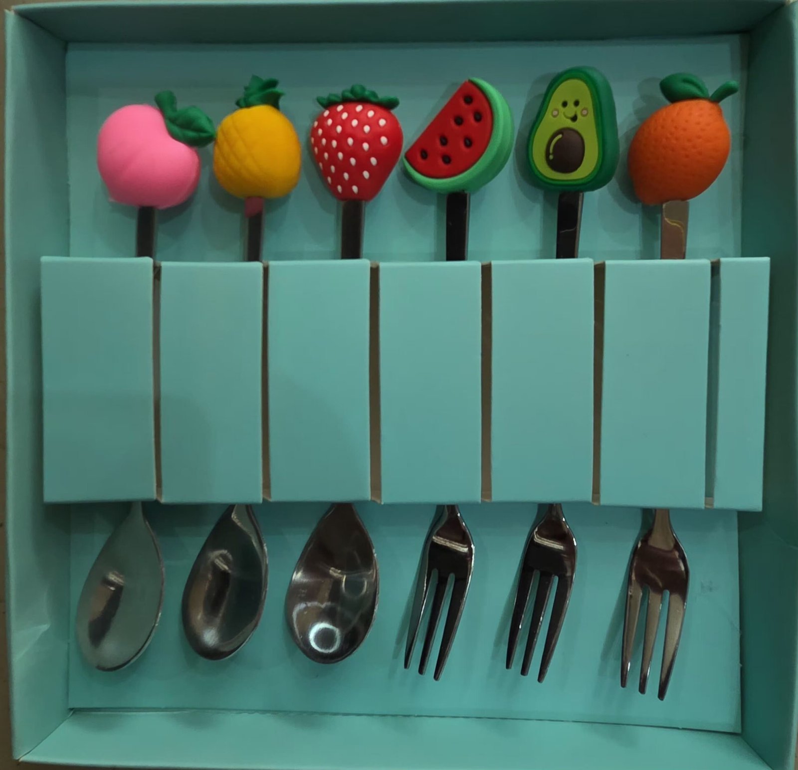 IMG-20260518-WA0005 6-piece stainless steel dessert spoon and fork set featuring colorful, cartoon-style donut decorations on the handles. - Image 1